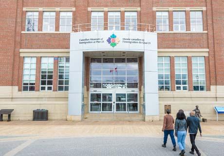 Visitors walk towards the front entrance to the Museum.