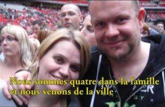 Woman and man are standing in an arena.