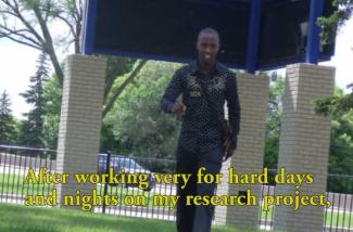 A young man walks confidently toward the camera.