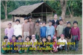 Lots of children seated and standing pose for the camera.