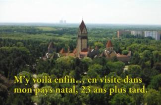 Church spires can be seen over the tree tops.