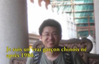 A young man with a backpack stands, smiling for the camera.