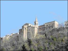 View from below of huge building on side of hill.