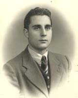 Portrait of Basilio, wearing suit and tie.