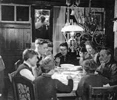 Candid shot of the Bekkers, seated at the dinner table.