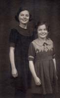Portrait of Catherine and Anne as young girls, wearing dresses.