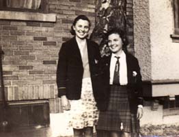 Catherine and Anne standing outside house in Canada.
