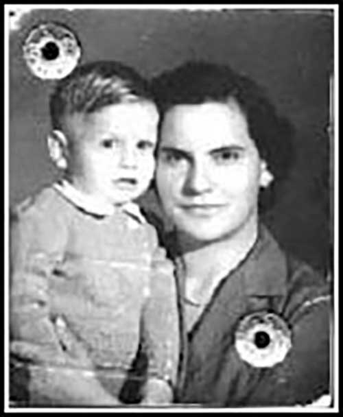 Black and white portrait of woman holding small boy.