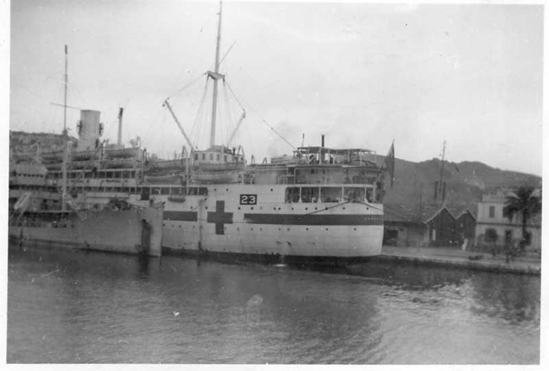 Ships are docked in the port.