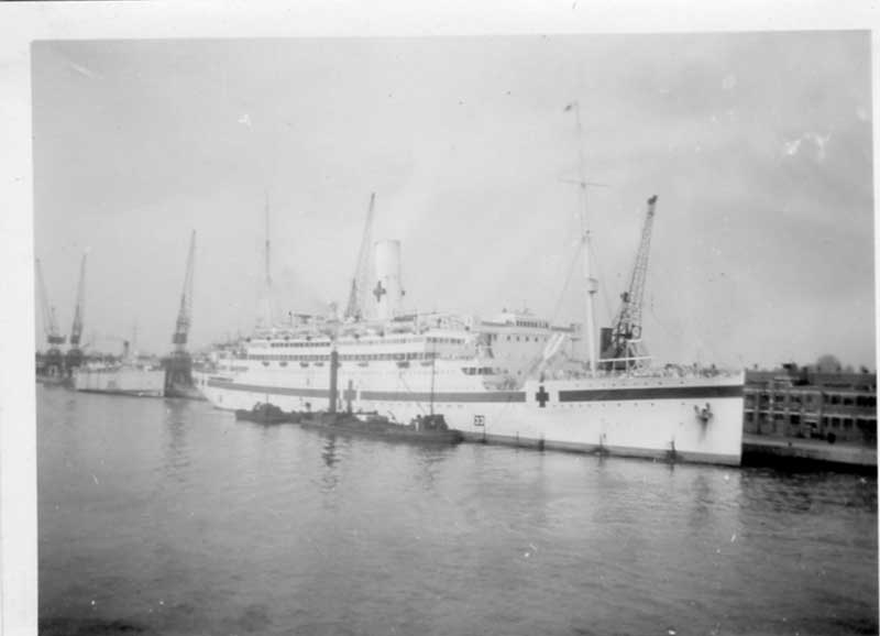A ship with a red cross sign.