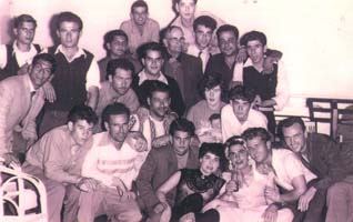 Eddy with large group of friends and family on board ship.