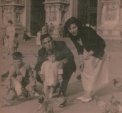 Poggi family feeding pigeons on a popular town square.