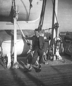 The young Finn leaning against the pulleys of a lifeboat aboard the Stavangerfjord.