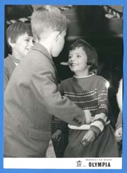Three young children playing.