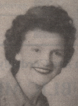 Head portrait of a young woman with short brown hair.