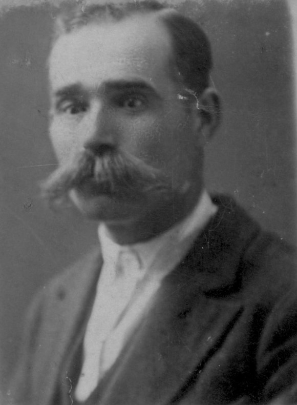 Archival passport photo of a man in 1929.
