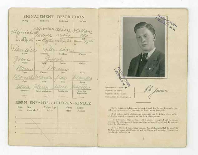 Black & white photo on the passport page with stamp.