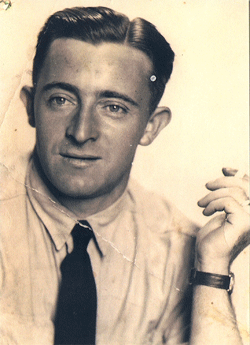 Cecil as an older man in grey suit and burgundy tie.
