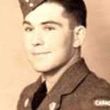 Black and white portrait of young male soldier wearing uniform.