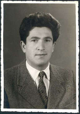Portrait of young Leonardo wearing suit and tie.