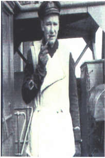 Man in uniform, smoking pipe.