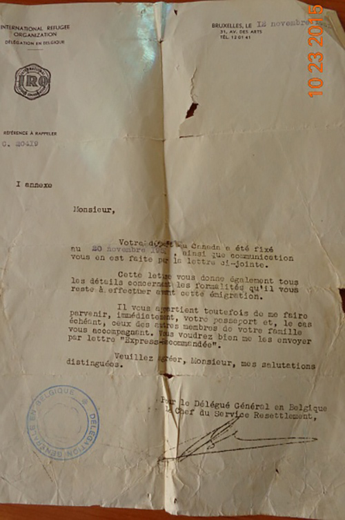 Faded torn document with a stamp and signature at the bottom.