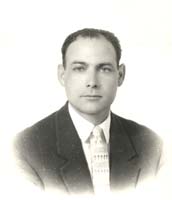 Portrait of Matteo in dark suit and light-coloured tie.