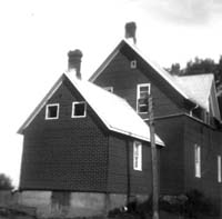 Farm house of dark color.