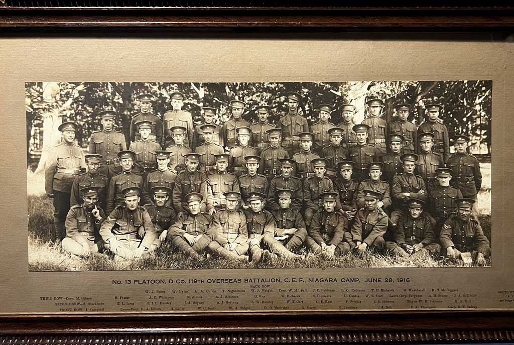 Framed wall portrait of service men.