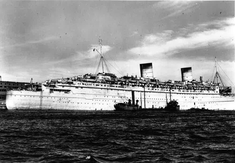 The huge ship, Queen Elizabeth, as seen from another ship while docked in Halifax.