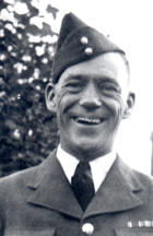 Smiling Arthur in uniform and cap aslant on head.