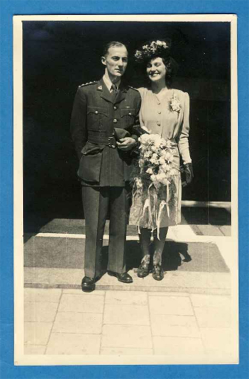 A man and a woman in fancy clothing, seemingly from decades ago.