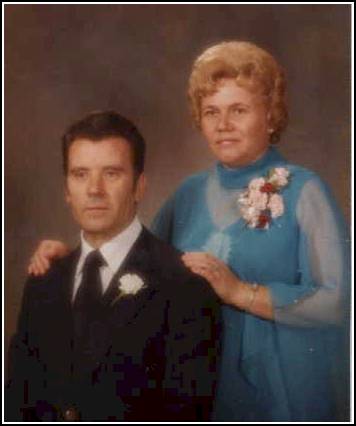 A man and a woman in fancy clothing, seemingly from decades ago.