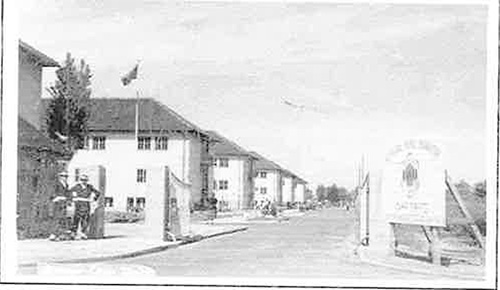Faded photograph of a refugee camp in Germany.