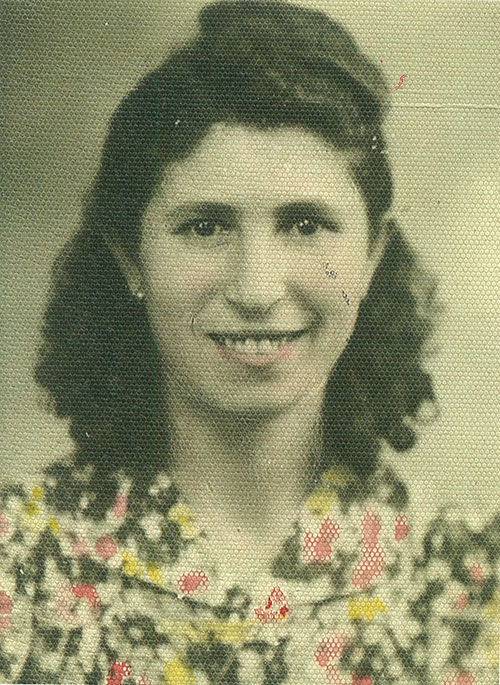 Teresa in a beautiful flower printed top and smiling for the camera.