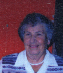 Recent, coloured photo of older Gladys, wearing blue and pearls.