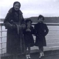 Woman with two children standing against railing of ship, Scythia.