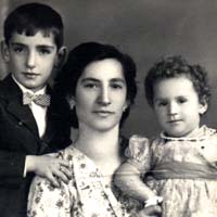 Close up photo of passport image showing woman, small boy and baby girl.