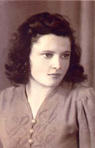 Sepia-toned portrait of Teresa, looking off to the side.