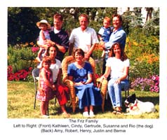 Garden shot of seated and standing family members.
