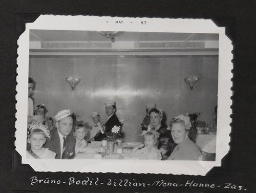 Group of people sitting and looking at camera.